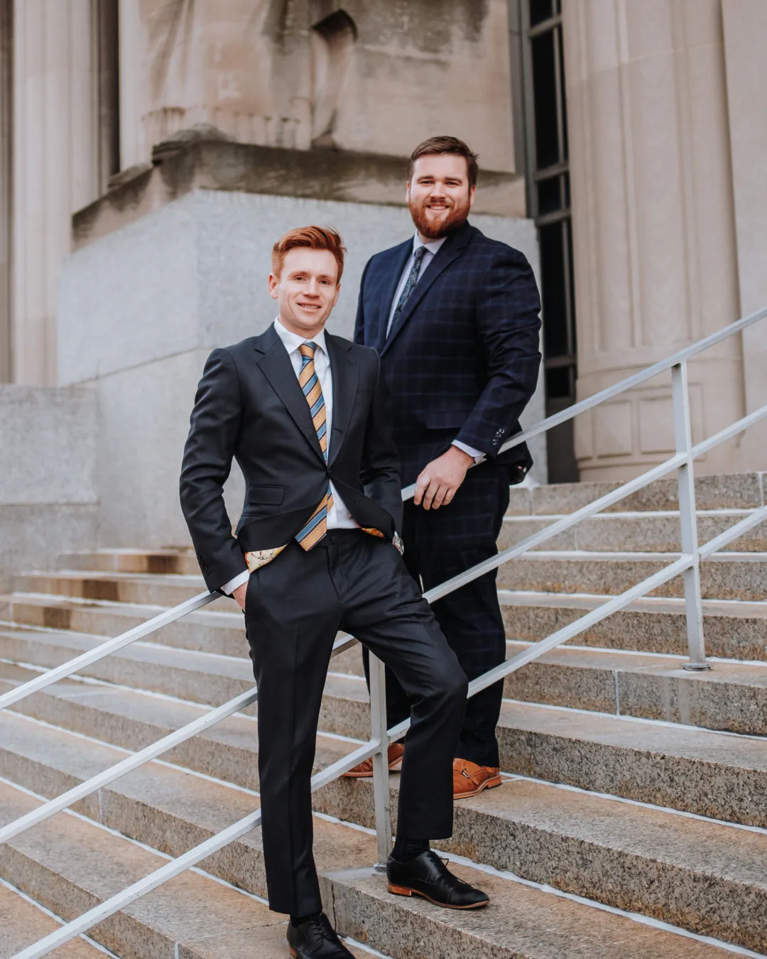 Ryan Krupp, Austin Raboin standing on the steps outside the St. Louis Court house