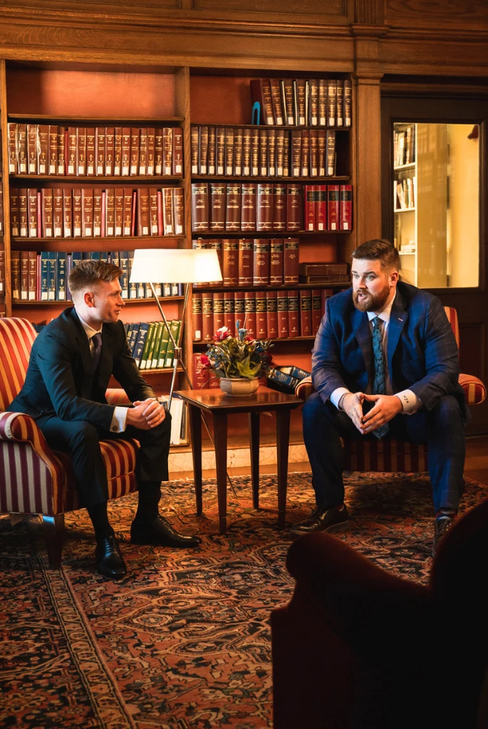 Sitting left to right - Ryan Krupp, Austin Raboin in the law office library